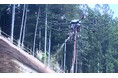 【髙松グループ】世界初※東興ジオテックとエアロセンス、大型有線給電ドローンによる植生基材吹付工を現場導入