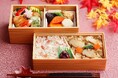なだ万【9/20より期間限定販売】秋の風を感じるご馳走 松茸と蟹が彩る贅沢な二段弁当「松茸御飯と蟹御飯の二段重」のご案内