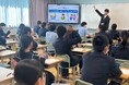 金融教育プロジェクト「ABCash for School」の一環として中学3年生153人に向け「理想の高校生活を送るために知っておきたいお金の話」がテーマの特別授業を実施