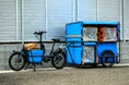 Amazon、リヤカー付き電動アシスト自転車の新モデルを導入し、過密地域での配送の負担を軽減