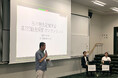「日本観光経営学会第7回カンファレンス・シンポジウム」にパネリストとして登壇。 学識者や観光事業者などに対し「観光DXで開く地域の未来」をテーマに講義。
