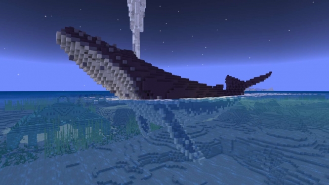 潮を噴き上げながら泳ぐ巨大なクジラ。