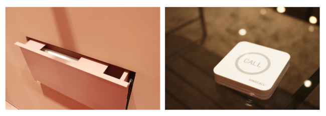 試着室の壁にはフェイスカバーを収納。スタッフに聞きたいことがあれば右画像のベルで呼び出しも可能。 試着室の壁にはフェイスカバーを収納。スタッフに聞きたいことがあれば右画像のベルで呼び出しも可能。