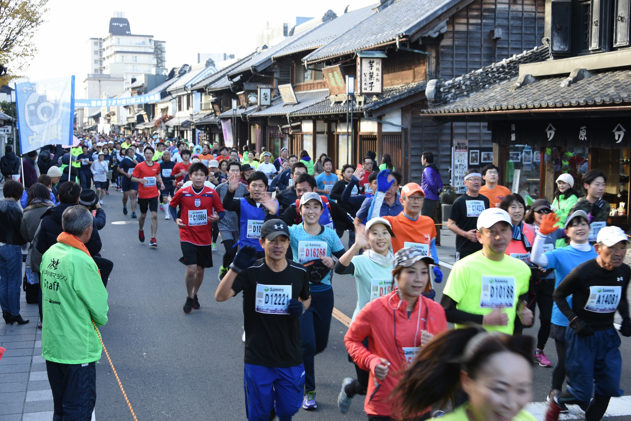 Runners in the Koedo Kawagoe half-marathon passing along the historic streets of Kawagoe, Japan