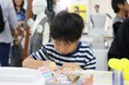 年齢と共に変化する“見える”と“聞こえる”を考えるワークショップ。眼鏡市場が『キッズいきるちからフェス2024』に出展